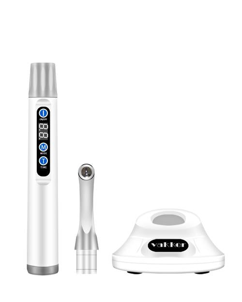 Vakker dental curing lamp components on white background.