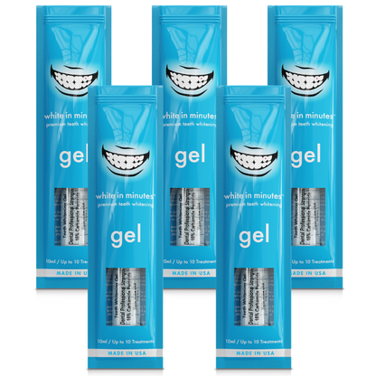Five White in Minutes® 16% carbamide peroxide teeth whitening gel syringes and retail packages arranged on a white background, designed for use with whitening trays.