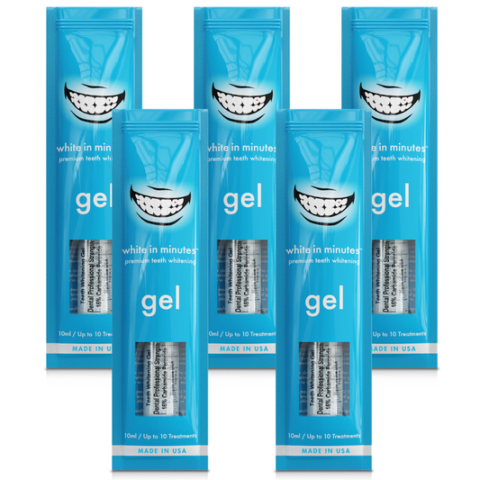 Five White in Minutes® 16% carbamide peroxide teeth whitening gel syringes and retail packages arranged on a white background, designed for use with whitening trays.