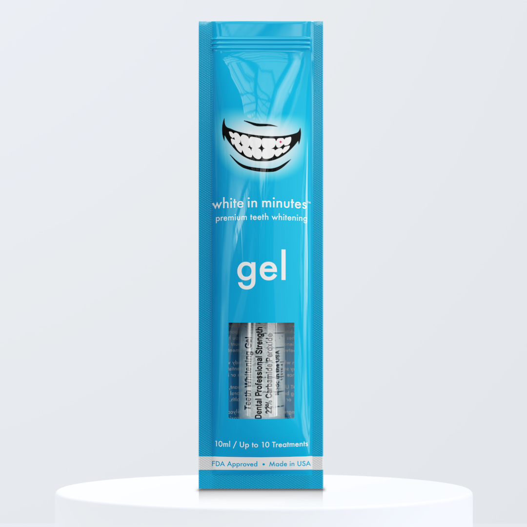 Blue pouch of White in Minutes 22% carbamide peroxide tooth whitening gel on a white platform with a light gray background.