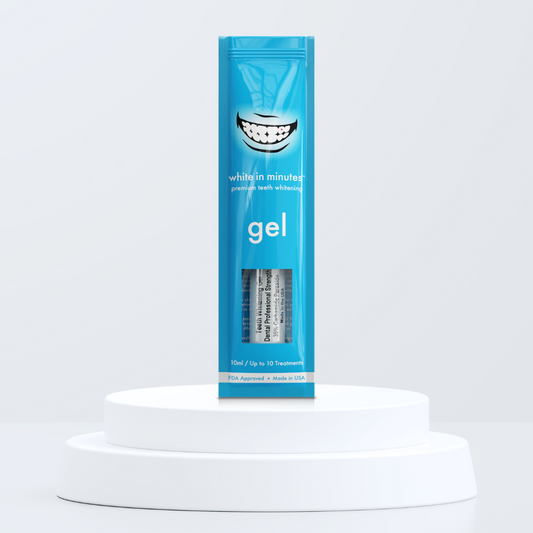Blue pouch of White in Minutes 35% carbamide peroxide tooth whitening gel on a white platform with a light gray background