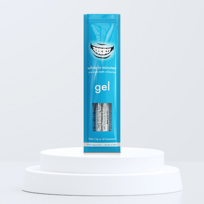 Blue pouch of White in Minutes 44% carbamide peroxide tooth whitening gel on a white platform with a light gray background