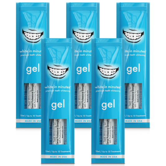 Five White in Minutes® 44% carbamide peroxide teeth whitening gel syringes and retail packages arranged on a white background, designed for use with whitening trays.