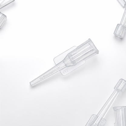 Clear plastic pipette tips on a white background