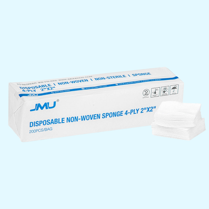 Box of disposable non-woven sponges with JMU branding on a light blue background