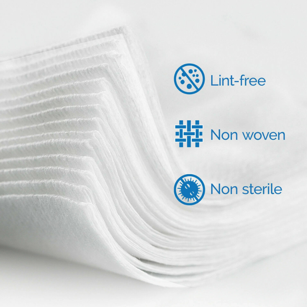 Stack of white non-woven materials with 'Lint-free', 'Non-woven', and 'Non-sterile' labels on a light gray background.