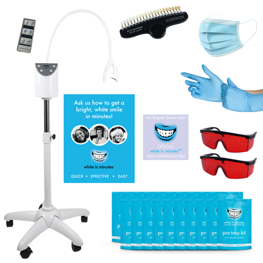 A collection of teeth whitening products and supplies including a whitening lamp, protective glasses, tray kits with gel, and marketing materials.