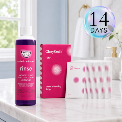 White in Minutes purple whitening mouthwash bottle and PAP+ teeth whitening strips kit displayed on a clean marble bathroom counter with soft natural lighting, featuring a modern, approachable at-home teeth whitening setup.