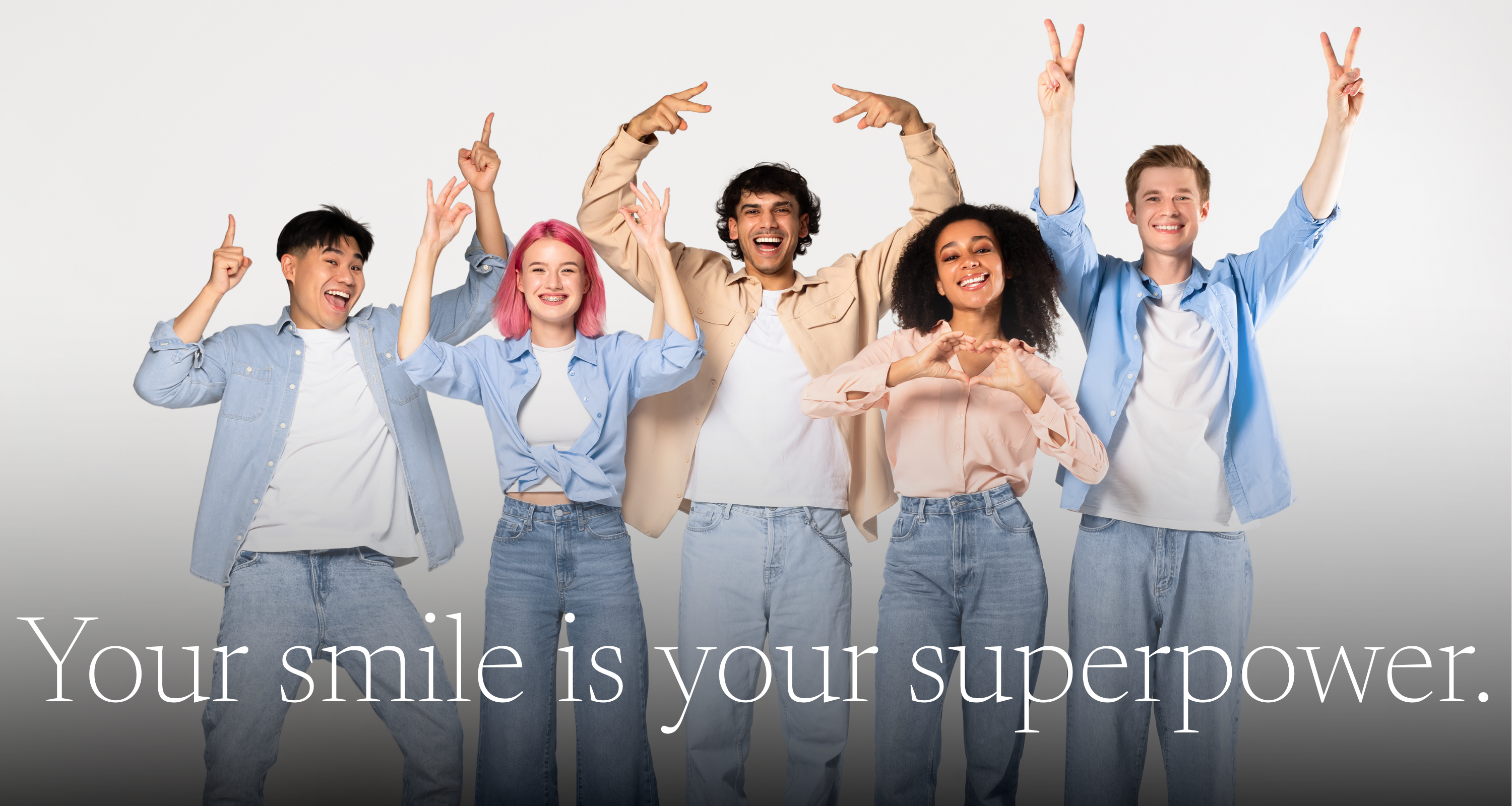 Five people with raised arms and a motivational quote on a light gray background with white text reading "your smile is your superpower.
