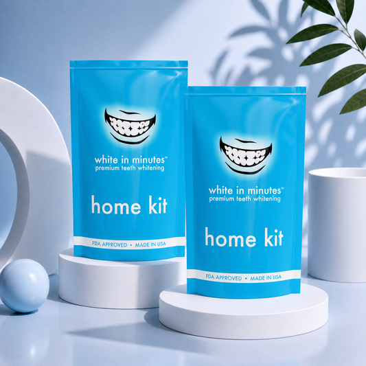 White in Minutes teeth whitening for two set with two home whitening kits displayed on a marble bathroom counter in a clean, modern setting.