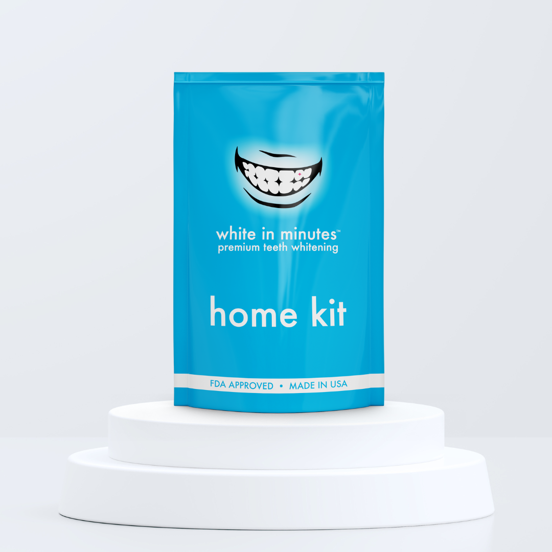 Blue White in Minutes teeth whitening home kit packaging on a white pedestal with a light gray background