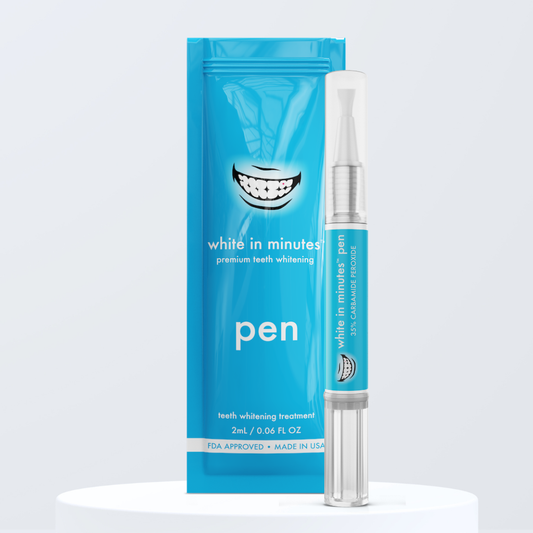 Teeth whitening pen with blue packaging on a light gray background and white pedestal