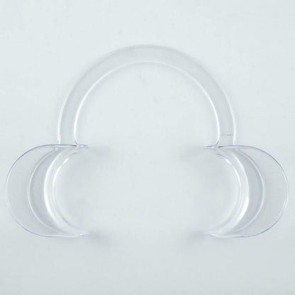 Clear plastic dental cheek retractor shown from the front on a white background, featuring two curved side sections connected by a rounded upper handle.