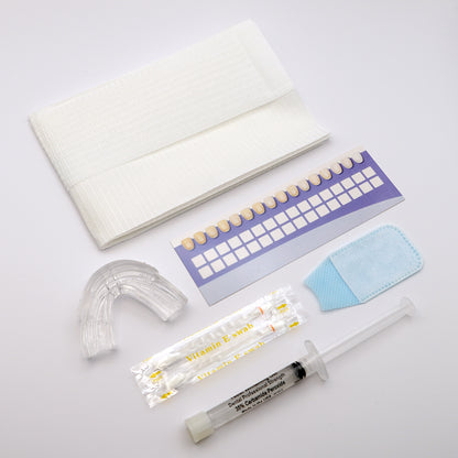 White in Minutes Pro Tray Kit Contents - Includes 3ml 35% carbamide peroxide teeth whitening gel, teeth whitening tray, paper tooth shade guide, vitamin e swabs, disposable finger wipe and self-adhesive bib.